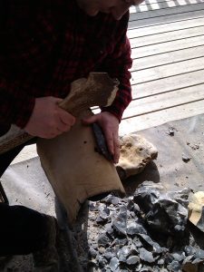 Making a handaxe during a demo at Nell Bank.